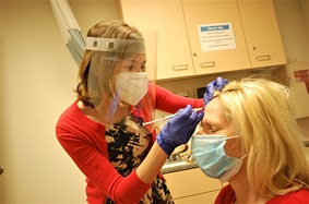 Katherine Hamilton treating headaches for patients  