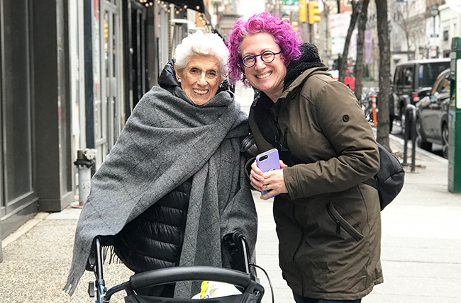 Sunnie spine patient story back fracture walking outside with friend 