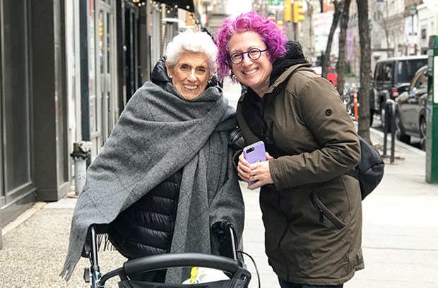 Sunnie spine patient story back fracture walking outside with friend 