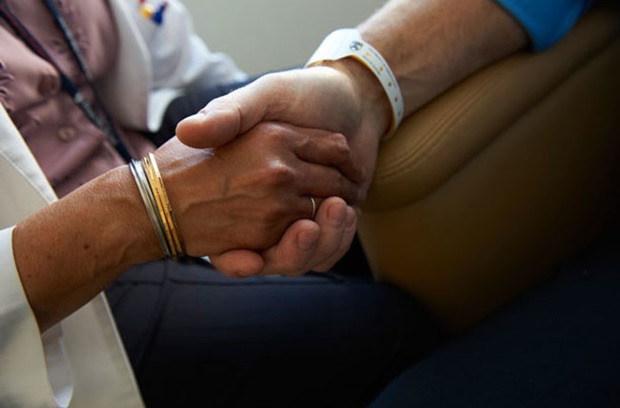 Physician comforting patient