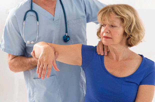Doctor inspecting patient's arm