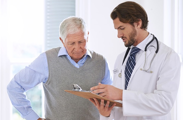 Doctor speaking with elderly patient