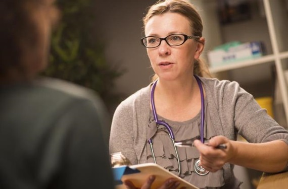 Physician discussing with patient