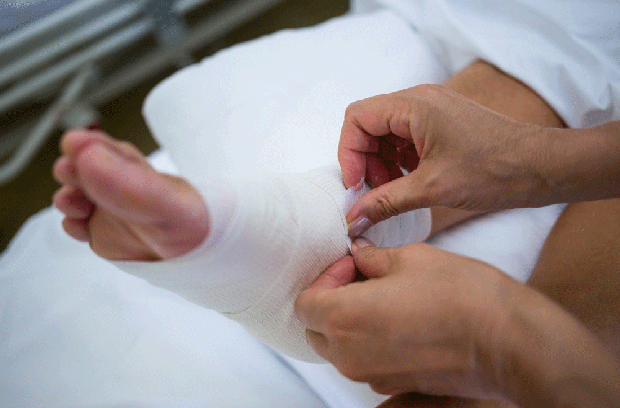 Patient getting foot and ankle wrapped