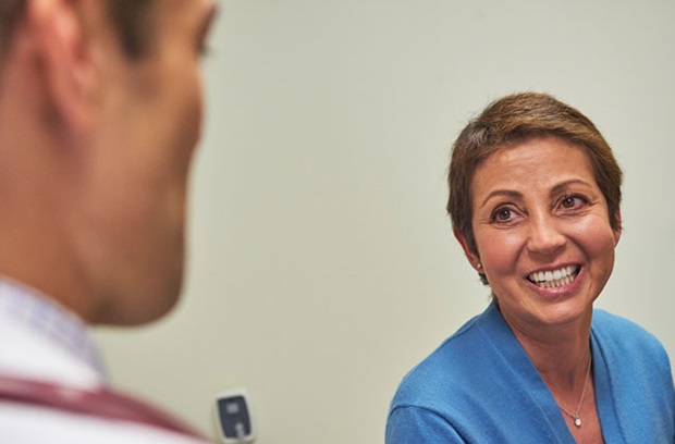 Woman speaking with physican