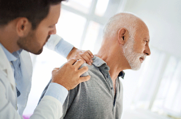 Provider evaluating patient's shoulder