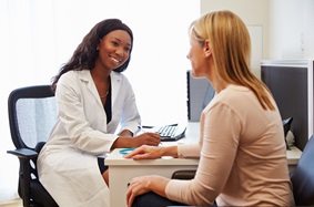 female patient in female doctor's office