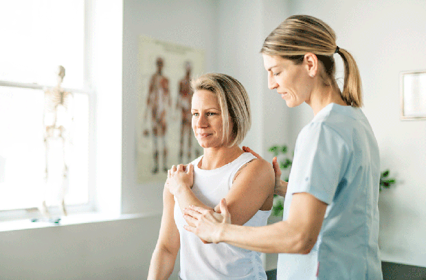 Woman receiving rehabilitation for elbow injury