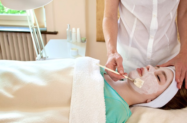 Woman receiving a chemical peel facial