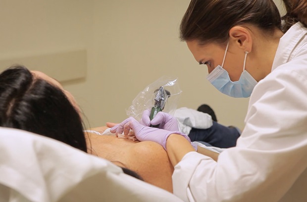 Woman receiving a nipple and areola tattoo