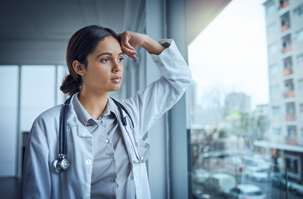 woman looking out a window