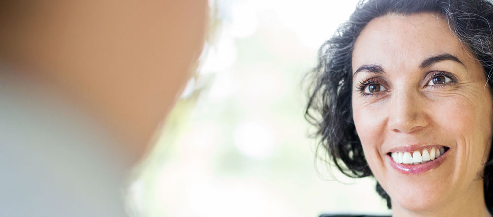 A woman smiling