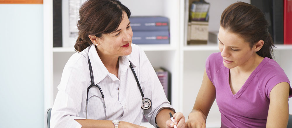 Physician speaking with patient