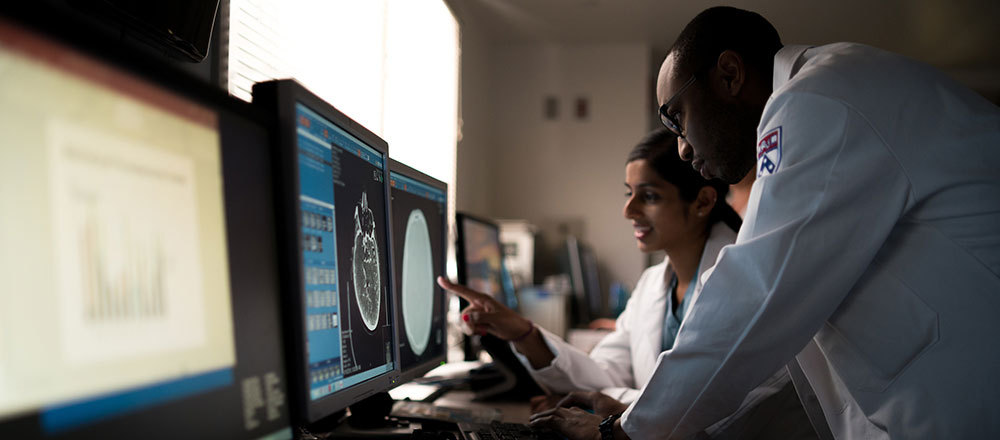 Radiologists studying scans