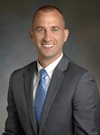 headshot of John H. Bast, MD