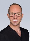 headshot of Brett Chatman, DPM